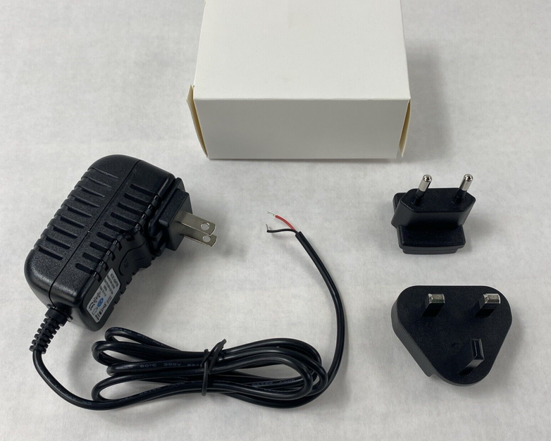 Unbranded BX18W-1201000 12V 1A AC/DC Adapter w/ International Wall Plug Adapters