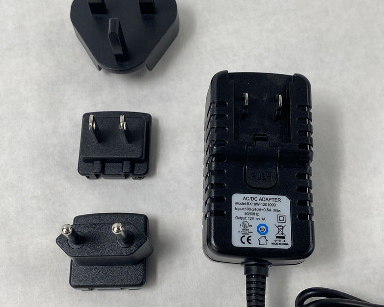 Unbranded BX18W-1201000 12V 1A AC/DC Adapter w/ International Wall Plug Adapters