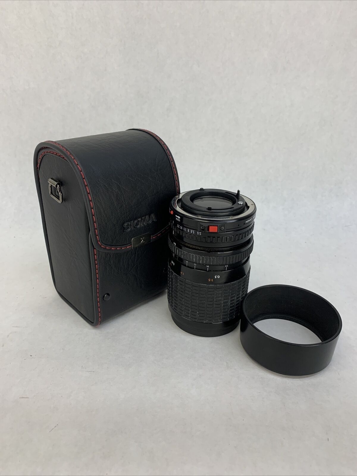 Sigma Zoom III Lens 1: 3.5- 4.5, 28 - 84 mm For Canon w/Hoya UV[0] Filter