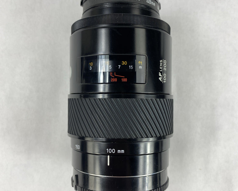 Minolta Maxxum 7000 AF SLR 35mm Film Camera With Extra Lens and Flash Attachment