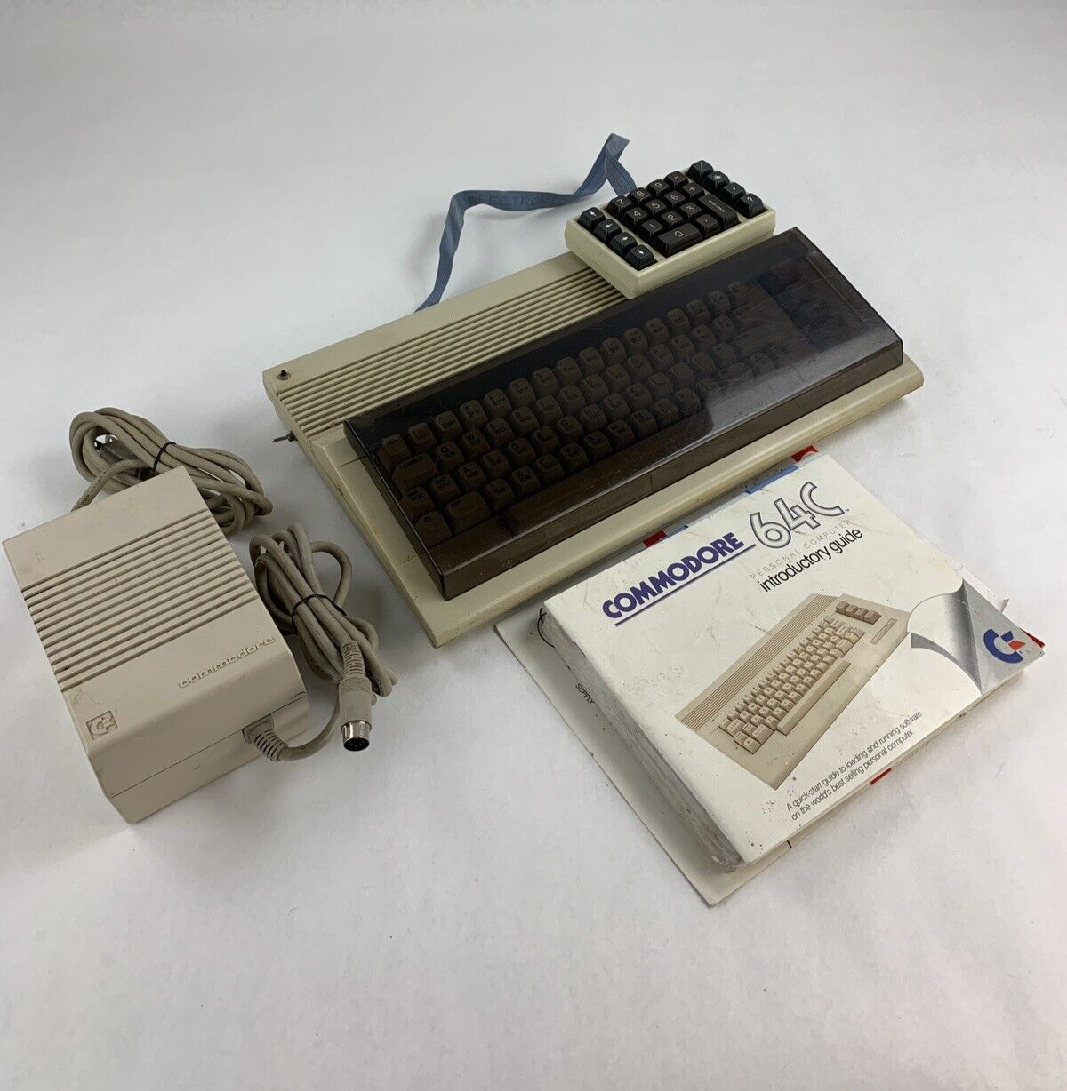 Commodore 64 64C Computer System Boots w/PSU, NKP Deluxe Keypad, and Manuals