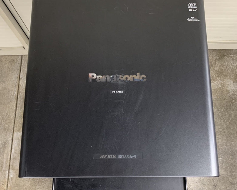 Panasonic PT-DZ10KU WUXGA DLP Lamp Projector 3077 H - Tested No Lens No Remote