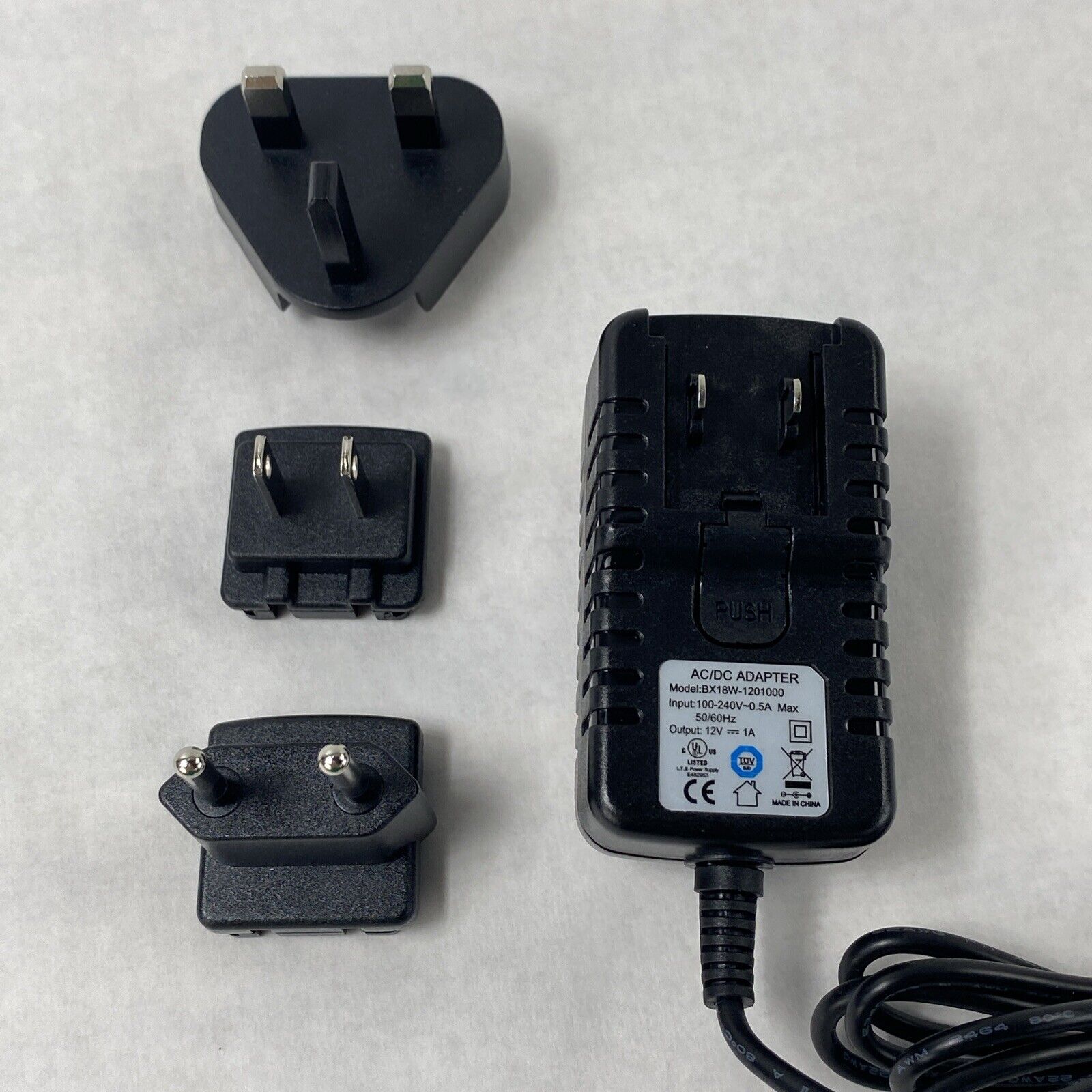 Unbranded BX18W-1201000 12V 1A AC/DC Adapter w/ International Wall Plug Adapters