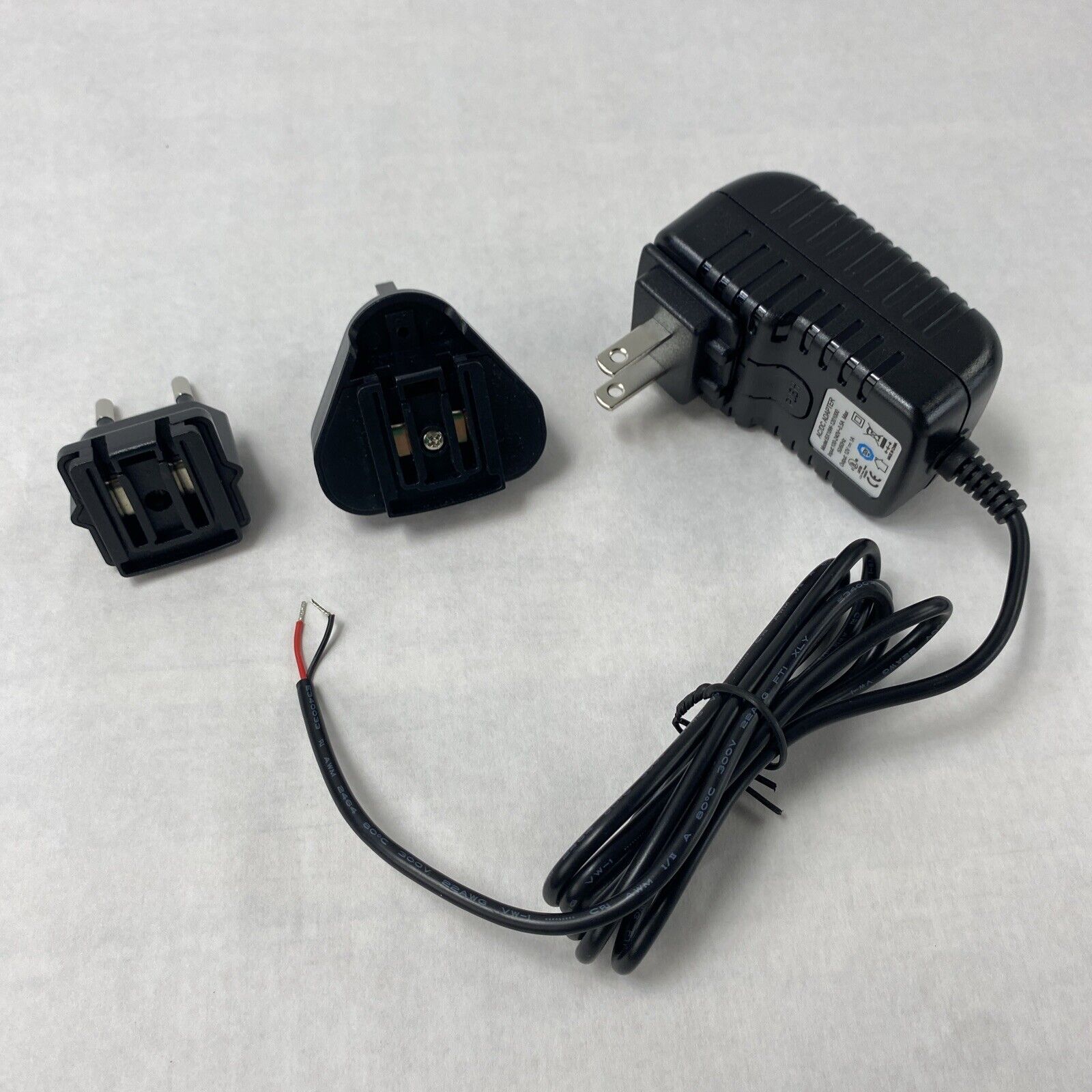 Unbranded BX18W-1201000 12V 1A AC/DC Adapter w/ International Wall Plug Adapters