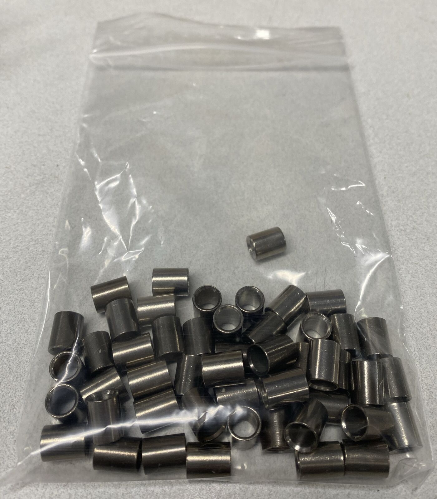 50pcs 9.9mm Countersinked Bushings 7.75mm OD 5.5mm ID Likely Stainless Steel