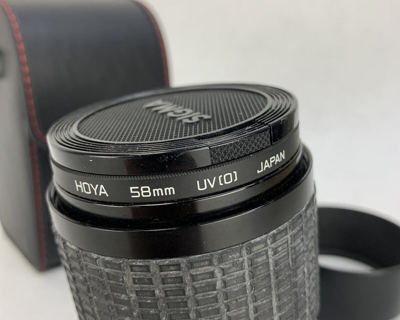 Sigma Zoom III Lens 1: 3.5- 4.5, 28 - 84 mm For Canon w/Hoya UV[0] Filter