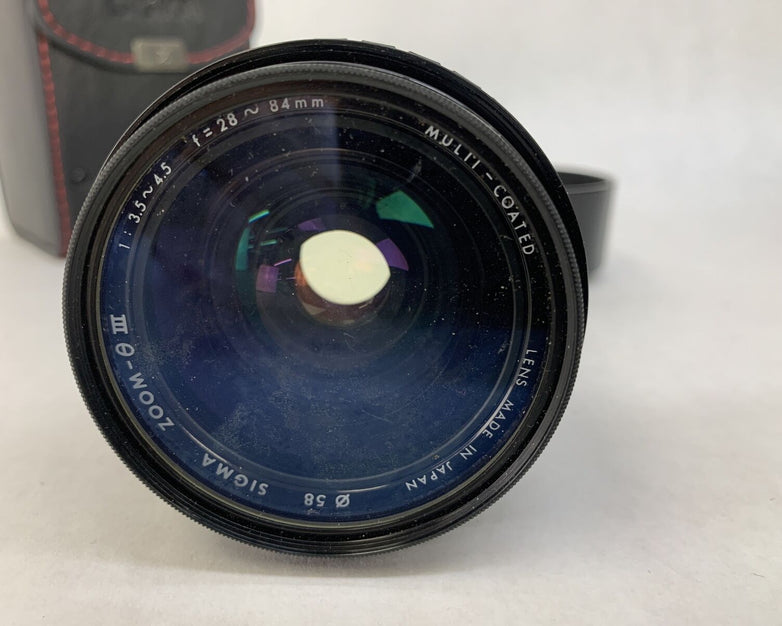 Sigma Zoom III Lens 1: 3.5- 4.5, 28 - 84 mm For Canon w/Hoya UV[0] Filter