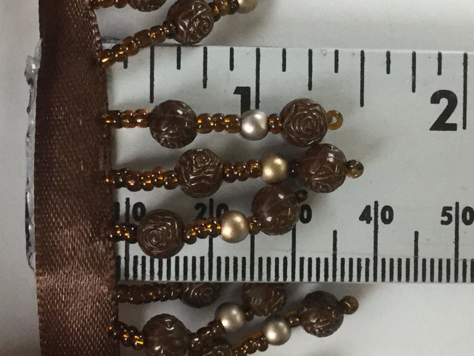 brown beaded decorative trim (1/4" ribbon + 1.25" beaded tassels)wide x 10 yards
