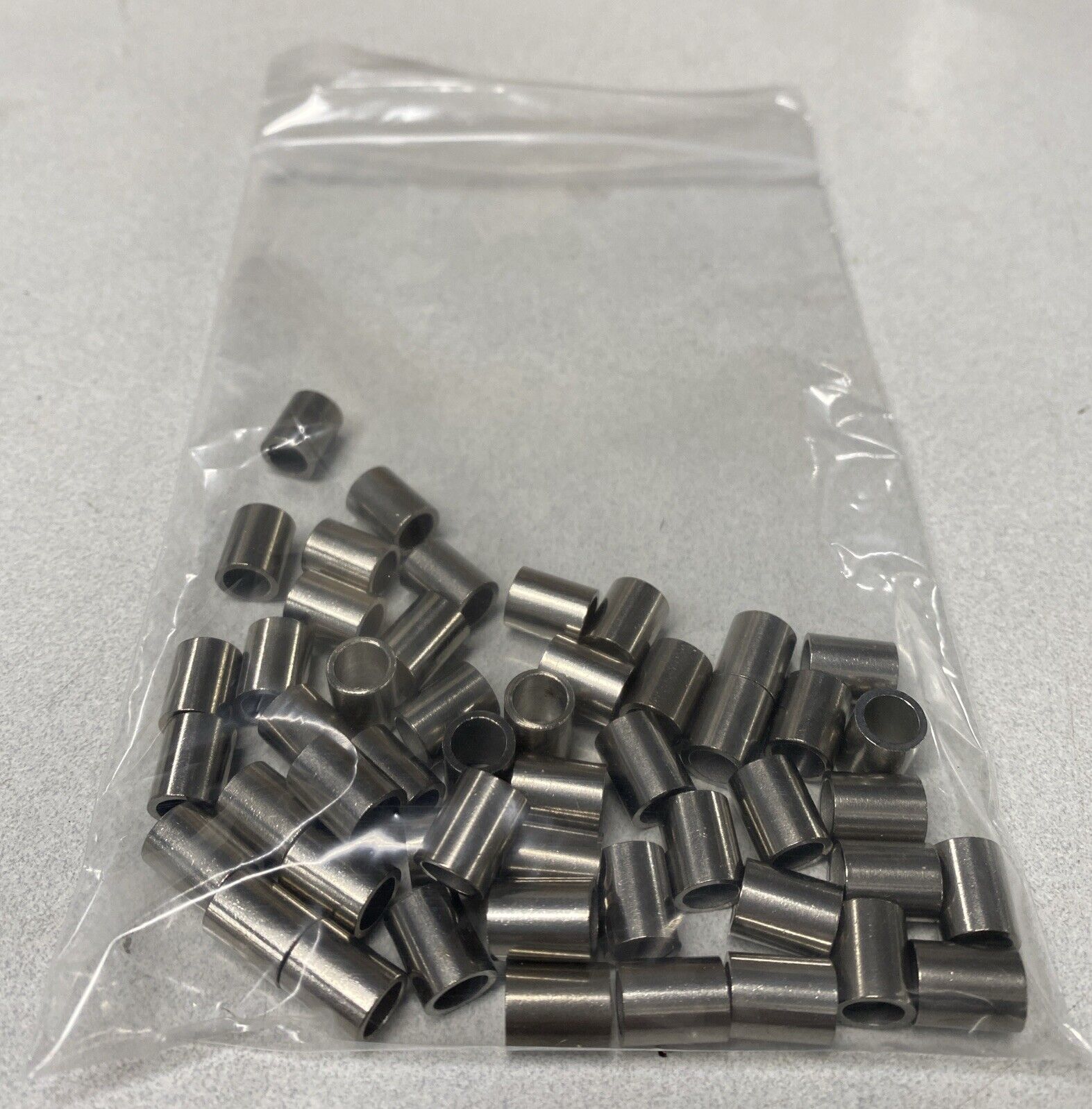 50pcs 9.9mm Bushings 7.75mm OD 5.5mm ID Likely Stainless Steel